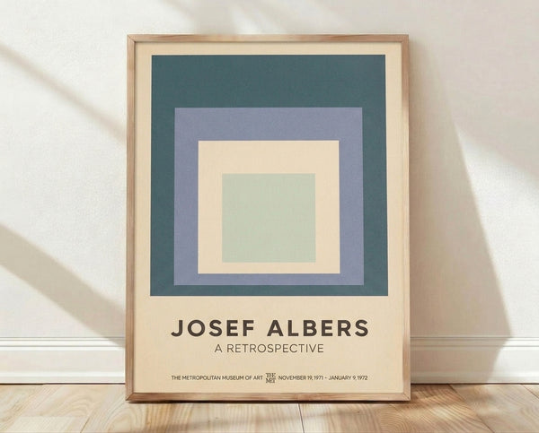Minimalist Bauhaus poster featuring nested geometric squares in teal, mauve, cream, and sage green creating a meditative, balanced composition on a framed wall art print.