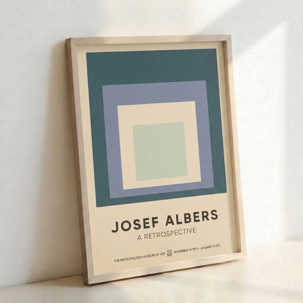 Modern framed poster displaying layered nested squares in a serene palette of sage green, mauve, teal, and cream, exemplifying minimalist Bauhaus design principles.