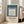 Geometric wall art featuring interlocking squares in muted sage green, teal, mauve, and cream tones creating a balanced, meditative visual rhythm in this museum-quality print.
