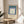 Contemporary poster art with concentric square forms rendered in cool and warm earth tones including sage green, teal, mauve, and cream for contemplative home decor.
