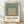 Framed geometric poster featuring concentric squares in sage green, slate blue, and warm gray tones, exemplifying Bauhaus minimalist design with a serene, meditative quality.