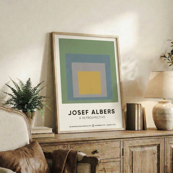 Framed art print presenting layered squares in cream, warm gray, and slate blue tones, capturing the serene essence of geometric color field abstraction.