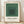 Minimalist geometric poster featuring concentric squares in sage green, forest green, charcoal, and cream tones, embodying Bauhaus design principles and meditative color harmony.