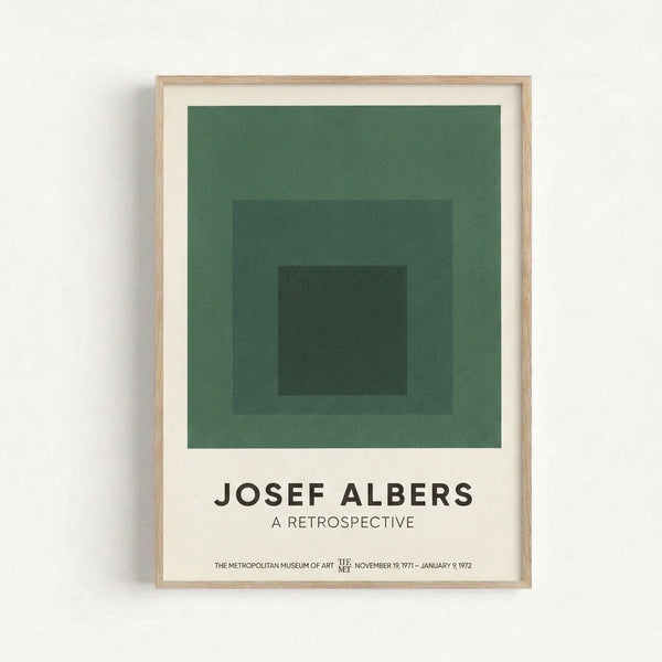 Framed Bauhaus art print with nested square forms in muted sage and forest green hues creating a contemplative study of color and geometric proportion.