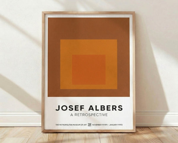 Minimalist abstract art print featuring concentric squares in warm earth tones of burnt sienna, terracotta, and golden orange, creating a meditative geometric composition.