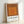 Contemporary geometric wall art displaying layered squares in burnt sienna and terracotta tones, embodying minimalist color theory and visual balance.