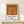 Abstract minimalist print with receding square forms in warm oranges and rust, arranged to create a calm, meditative focal point.