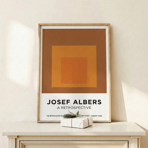 Abstract minimalist print with receding square forms in warm oranges and rust, arranged to create a calm, meditative focal point.