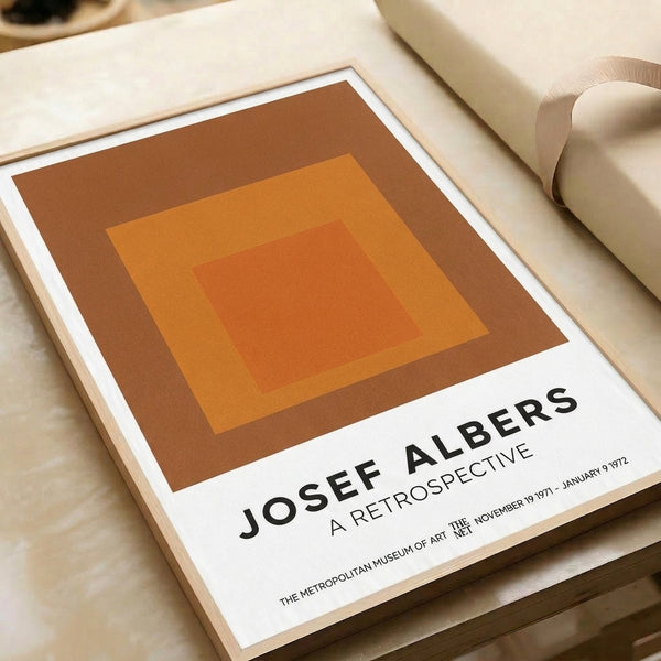 Minimalist abstract framed art with nested square compositions in terracotta, rust, and warm ochre, celebrating geometric harmony and chromatic subtlety.
