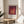 Abstract squares art print in a palette of warm reds, peach, and cream, showcasing the Bauhaus approach to color interaction and spatial perception.