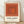 Abstract minimalist framed poster featuring nested squares in rust orange, terracotta, and cream tones, creating a meditative geometric composition.