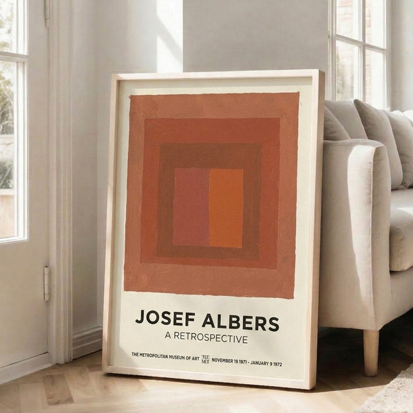 Framed contemporary art print of nested rectangular forms in warm orange and cream palette, embodying midcentury geometric minimalism.