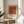 Abstract wall art showcasing interlocking squares in burnt sienna, rust, and cream, with a serene and contemplative color field aesthetic.