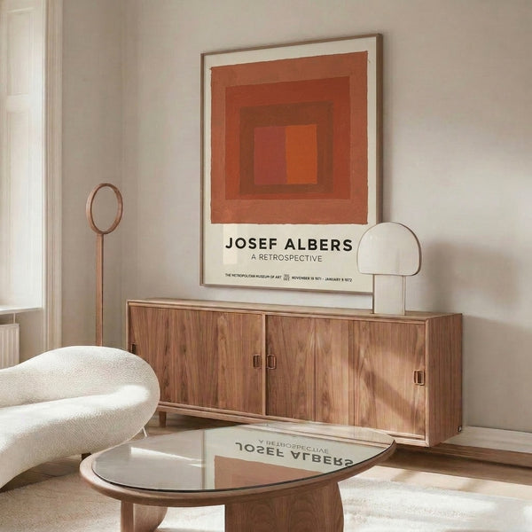 Minimalist poster featuring concentric geometric squares in warm terracotta and cream tones, evoking meditative abstract composition.