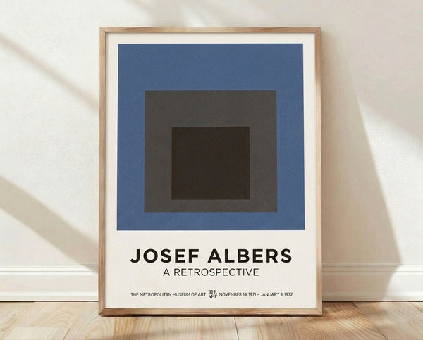 Minimalist Bauhaus poster featuring nested geometric squares and rectangles in slate blue, charcoal gray, and cream, creating a contemplative composition.