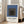 Contemplative minimalist framed print with interlocking rectangular shapes in sophisticated gray and blue tones, characteristic of modernist geometric art.