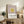 Modern geometric poster with overlapping rectangular shapes in muted mauve, mustard, and cream hues suggesting quiet contemplation through color and form.