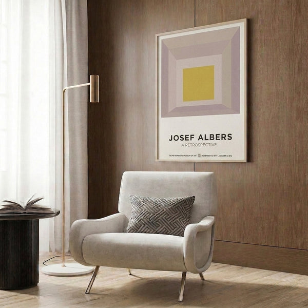 Framed abstract print featuring concentric squares in warm taupe and mustard with cream highlights, embodying minimalist Bauhaus principles.
