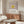 Contemplative geometric art with nested rectangles in soft earth tones of cream, mauve, and mustard yellow displayed as a framed wall poster.