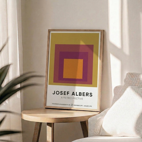 Minimalist arrangement of concentric squares in warm jewel tones including gold and burgundy, embodying the harmonious geometric principles of Bauhaus design as a framed wall print.