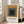 Contemporary framed poster with nested rectangular forms in warm gold, gray, and black hues, embodying the meditative essence of Bauhaus color theory.
