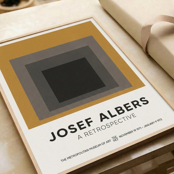 Modern wall poster featuring layered rectangular shapes in earthy mustard and gray tones with black accents, evoking meditative geometric minimalism and Bauhaus design philosophy.