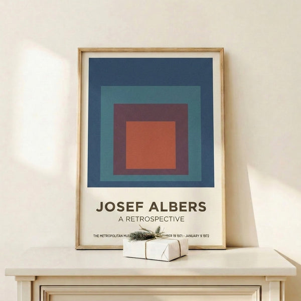 Abstract art print with layered squares in cool and warm tones including teal, maroon, and cream, reflecting minimalist principles of color and form.