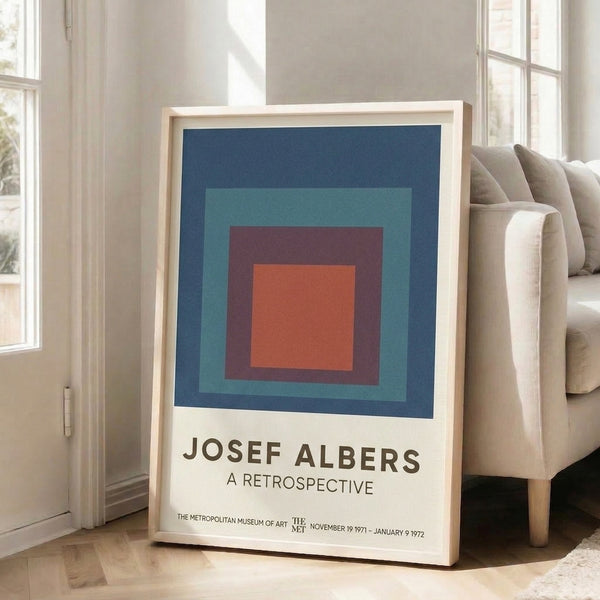 Museum-quality poster showcasing concentric rectangles in navy blue, burnt orange, and teal hues, evoking quiet geometric contemplation in Bauhaus tradition.