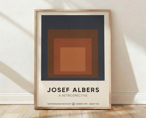 Minimalist abstract poster featuring nested squares in charcoal gray, rust brown, terracotta, and warm tan, creating meditative geometric harmony on a framed wall art print.
