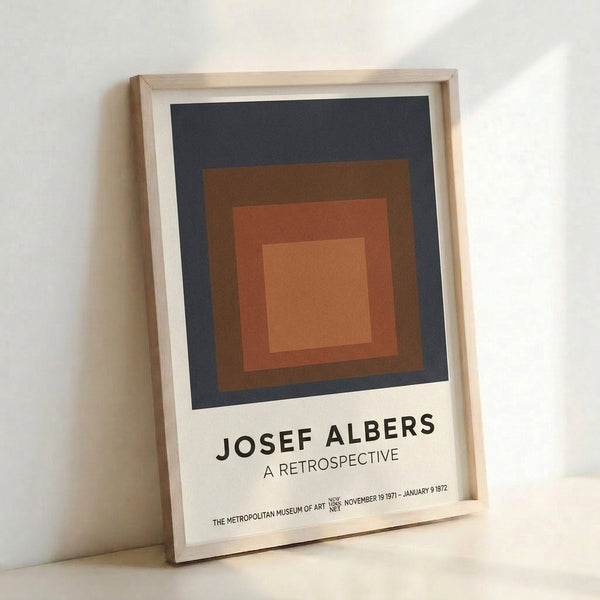 Abstract square composition in muted charcoal, terracotta, and tan layered concentrically, a modern minimalist poster print hung as framed wall art.