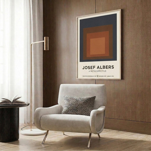 Minimalist poster art featuring overlapping squares in charcoal, terracotta orange, and tan—a study in geometric color harmony displayed framed on a wall.