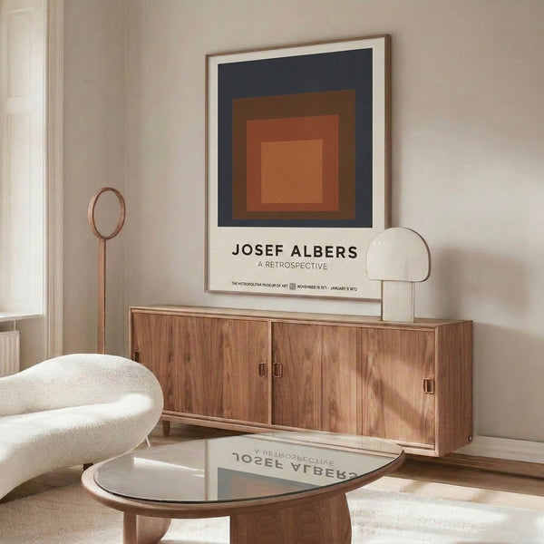 Color field abstract print with concentric squares in earthy rust, gray, and warm tones, exemplifying modernist geometric restraint as framed wall decor.
