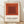 Framed minimalist poster featuring nested squares in rust red, burnt sienna, and cream tones, inspired by Josef Albers' geometric color field compositions.