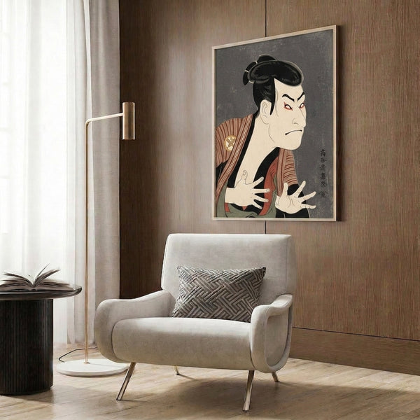 Japanese kabuki actor woodblock print on wall featuring dramatic makeup and ornate costume in rust red, gold accents, and deep greens with elegant composition and bold graphic style.