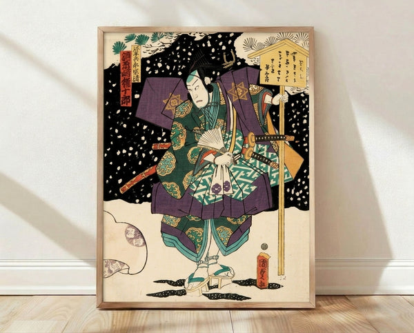 Framed Japanese woodblock print of Kawarazaki Gonjuro, a kabuki samurai in deep purple and forest green robes holding a katana and fan, set against a snowy winter backdrop with cream and gold accents.