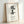 Framed art print of traditional Japanese kaizen calligraphy in black ink on neutral cream, evoking wabi sabi simplicity and contemplative mood.