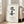 Serene minimalist poster showcasing bold black kanji brushwork centered on warm cream ground, capturing the essence of zen mindfulness.
