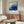 Aspiring modern art print with peaceful mountain vista in soft blues and gold, minimalist design for mindful home decor.