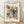 Abstract Bauhaus composition with geometric shapes including circles, rectangles, and dynamic lines in cream, yellow, red, teal blue, and black on a framed poster.