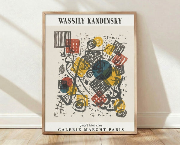 Abstract Bauhaus composition with geometric shapes including circles, rectangles, and dynamic lines in cream, yellow, red, teal blue, and black on a framed poster.