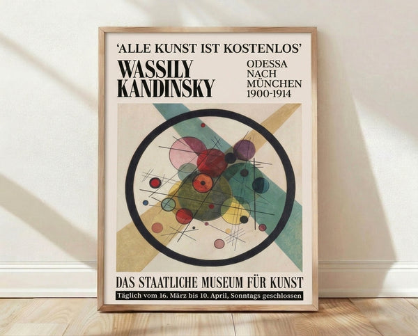 Abstract Bauhaus composition featuring overlapping circles and geometric planes in cream, teal, gold, and burgundy on a framed poster.