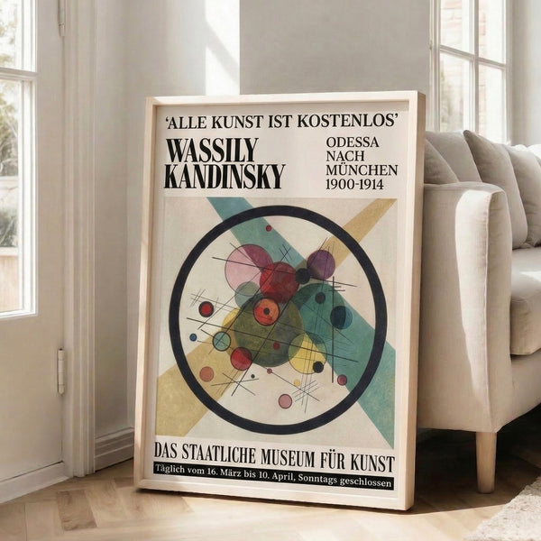 Framed modernist art print with interlocking geometric forms and circular elements in warm and cool tones creating visual movement.