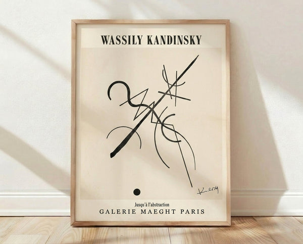 Abstract Bauhaus poster featuring geometric forms in black lines and circles on cream background, framed on wall.