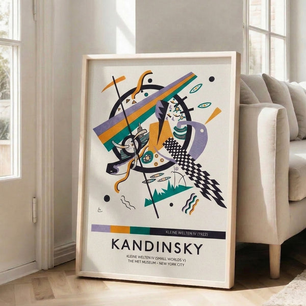 Framed Bauhaus abstract print displaying intersecting circles, triangles, and bold black lines against warm orange and cool teal hues.