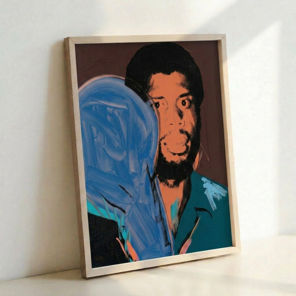 Framed pop art print of basketball legend Kareem Abdul-Jabbar rendered in bright, eye-catching color blocks characteristic of Warhol's iconic style.