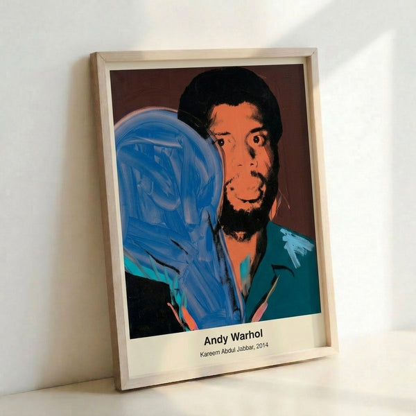 Vibrant pop art portrait of basketball icon Kareem Abdul-Jabbar in hot pink, electric blue, and yellow tones, capturing his likeness with bold graphic lines and high-contrast modern aesthetics.