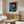 Framed pop art artwork of Kareem Abdul-Jabbar rendered in bold yellow, vibrant magenta, and electric blue hues with graphic modern styling.