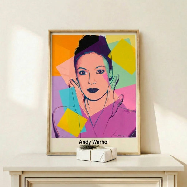 Iconic pop art print with a woman's portrait in vivid primary and neon hues, characteristic of Warhol's silkscreen style, framed on wall.