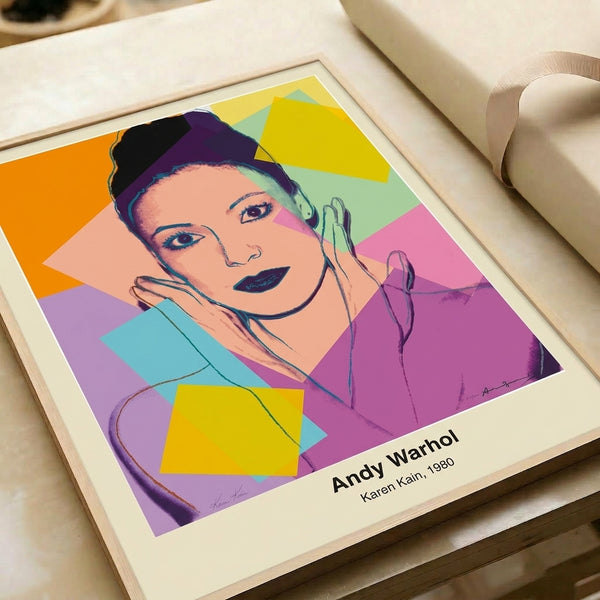 Bold silkscreen-inspired portrait of Karen Kain in vibrant neon palette of cyan, magenta, and yellow with stark black definition, wall-mounted poster.