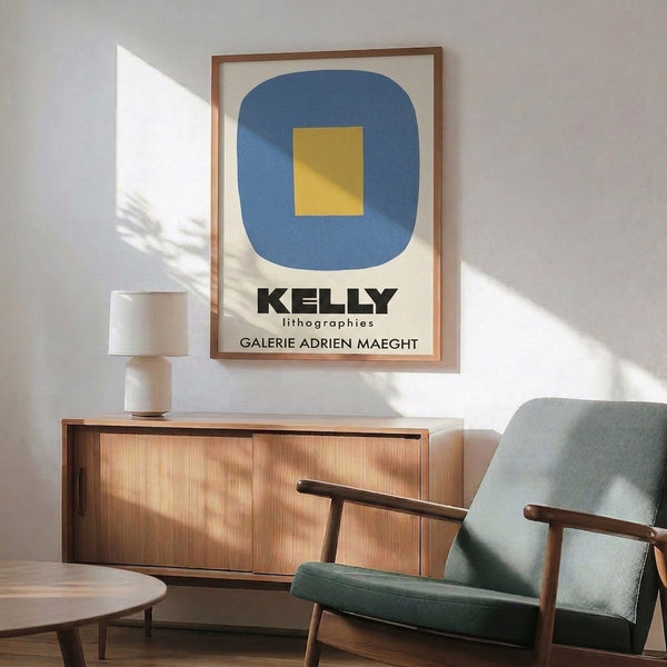 Calm, geometric framed print with rounded rectangle and square shapes rendered in golden yellow and slate blue tones on a cream background.